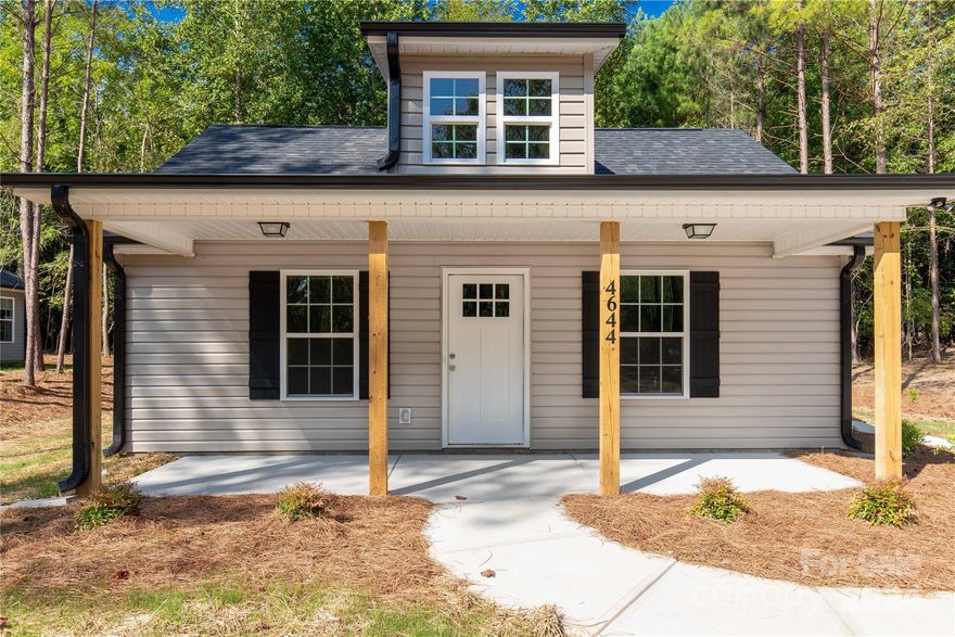 A beautiful new build on a .72-acre lot is available just outside the city limits. The house features a three-bedroom, two-full-bath floor plan on a "shotgun" style layout. The front porch is warm and welcoming, and the interior is just as cozy and elegant. The main living areas and bathrooms boast gray LVP flooring, while the bedrooms will have carpet. The kitchen and bathrooms have white cabinetry and granite countertops. The primary suite has its own en-suite bathroom and double closets. This home exudes Southern charm and sophistication. The exterior color will be Clay vinyl siding, and all colors and selections have been made to avoid any build delays.

*note: the photos are not of this home, but a similar one built in the area*