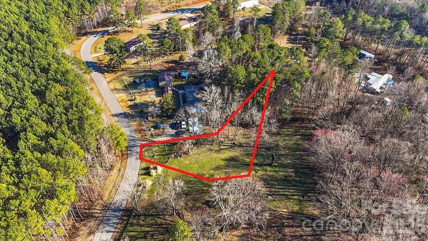 This property offers a quiet country environment in the north Lincolnton area of Lincoln County with convenient access to NC-150, providing an easy drive into Lincolnton, Denver, and toward the greater Charlotte region. The land features open, cleared space near the front, gently sloping terrain, mature trees toward the rear, and road frontage along Otis Dellinger Rd.

A 3-bedroom mobile home was previously located on the property and was removed years ago. The land was also used for horses in the past. An older well and septic system remain on the property from the previous home and are not warrantied. Buyer to verify condition and permitting. Buyer is encouraged to conduct soil/perc testing to confirm septic suitability and bedroom capacity. The property was surveyed in 2004.