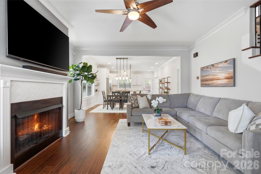 Tucked into the booming Belmont neighborhood and surrounded by some of Charlotte’s most desirable areas — Villa Heights, NoDa, and Plaza Midwood — this 2017-built home offers the perfect blend of modern luxury and walkable lifestyle. Enjoy effortless access to top restaurants, coffee shops, wine bars, breweries, and everyday conveniences.   Only a short distance from Uptown and just .5 miles away from greenway!
Inside, the home is in pristine, move-in-ready condition with an open, light-filled layout, vinyl plank floors throughout, and elevated designer lighting. The inviting great room features a gas fireplace with striking herringbone tile, flowing seamlessly into a spacious dining area and beautifully appointed kitchen with white soft close cabinetry, large island with pendant lighting, gas range, and generous storage.
The main-level primary suite offers a private retreat with a walk-in closet, freestanding soaking tub, and oversized walk-in shower. Upstairs includes a full guest suite with private bath, plus two additional large bedrooms connected by a hall bath with dual vanities and separate shower room. An oversized walk-in attic provides additional storage.
Step outside to a flat, fully fenced backyard designed for entertaining and future possibilities — whether hosting around the fire pit, relaxing on the large deck, or envisioning a pool with custom outdoor living space. This is city living with space, style, and convenience — all in one of Charlotte’s most connected and rapidly growing areas.  Not to be missed!