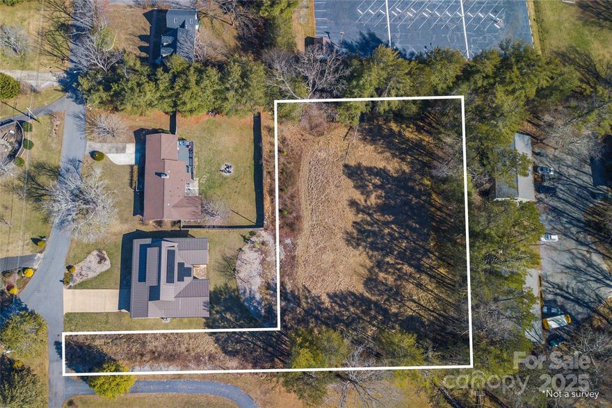 Incredible opportunity to build your dream home in Haw Creek, one of East Asheville's most desirable areas. Super rare completely level one acre lot can accommodate a variety of build plans. Zoning allows home plus ADU/guest house. City water and sewer available (tap fees required) and natural gas. Flag lot sits back from road and is tree-lined along the back of the property, offering a private setting. Minutes to schools, shopping and dining and less than 10 minutes to the heart of Downtown Asheville.