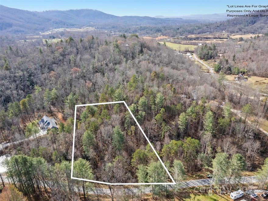 This remarkable property is nestled in the gorgeous Blue Ridge Mountains of Western NC in the sought after Hoopers Creek community of Fletcher!  It's convenient to both I-26 and I-40, the Asheville Regional Airport, great restaurants, shopping and hiking. So convenient yet so removed from it all!  There is the potential for great views with the removal of a few trees.  This wooded 2.1+/- acre property will allow for lots of privacy in a peaceful area where you will want to sit on your porch and enjoy the sounds of nature.  You will feel like you are in your own world!  There is long frontage on a paved, NC DOT maintained road.  Build your new home and still have room for your animals. Per County zoning, modulars and double wides are allowed.  Please note: BUYER will be responsible for clearing that portion of the Property required by the County to perform tests, inspections and/or evaluations to determine the suitability of the Property for a sewage system and/or private drinking water well.