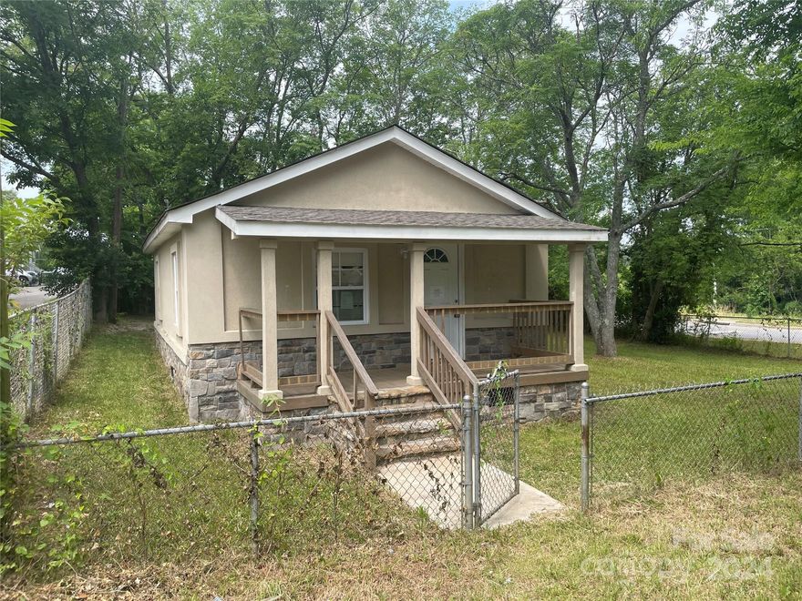 This renovated 1950’s home has an open floor plan and plenty of upgrades to include Flooring, Bathroom and Kitchen with shaker-style cabinets along with stone countertops, a custom tile backsplash. Washer and Dryer Hookup's Home is Totally Fenced in. Covered Front Porch. Home Sold As-Is. This home is incredibly inviting and attractively priced.