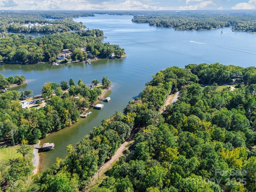 What an extraordinary opportunity to design and build your dream home with Miller Homes, Lake Wylie’s premier luxury builder! This lot is perfectly positioned, offering year-round water views and tucked just inside the cove. The homesite combines the best of both worlds: calm waters for private enjoyment and quick access to the main channel for boating, paddleboarding, or an evening cruise. Situated near The Palisades Country Club, you have the option to enjoy an exceptional lifestyle community featuring a Jack Nicklaus–designed golf course, tennis and pickleball complex, swimming pool, and country club (additional membership required). Enjoy all that Charlotte offers, close to the airport, and all the dining and entertaining options the city has to offer.  Elevate your lifestyle with Lake Wylie living!
