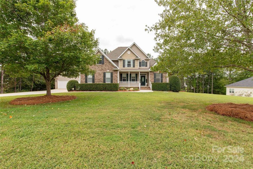 Welcome to 4301 Dashley Circle, where elegance meets tranquility in the heart of Catawba, SC. This immaculate four-bedroom, two-and-a-half-bath home is nestled on a picturesque 1.34-acre lot, featuring a well-manicured yard that enhances the property’s pristine curb appeal. Inside, you’ll find a seamless blend of classic charm and modern convenience, with gleaming real hardwood floors and a kitchen with stunning granite countertops, perfect for gatherings or entertaining guests. Enjoy the light-filled sunroom, ideal for sipping your morning coffee or unwinding after a long day. The spacious layout offers plenty of room to relax, including a large back deck that overlooks the serene landscape, perfect for outdoor dining or weekend barbecues. The attached two-car garage adds convenience, while the detached two-car garage offers endless possibilities for storage, a workshop, or a hobbyist’s dream space. Do not let this rare opportunity pass you by! Make your showing request today!