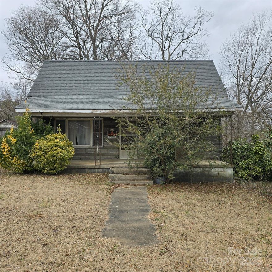 Calling all investors, DIYers, and visionaries! This 1930s bungalow is ready for a complete restoration OR it just might be the perfect site for someone to build a brand-new home. Situated on a beautiful, level lot, the property includes a single-door detached garage and a storage building. While the home requires significant repairs to be livable again, its charm, gorgeous lot, and potential make it a fantastic opportunity for the right buyer.  There are two parcels that convey with this sale.