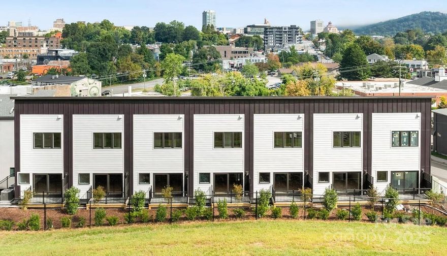 New Listing in the Garden Place Townhomes. Developer offering Major Price Concession on Model Unit 104 available for Showings: Go and Show! Originally offered pre-construction; Developer is now ready to offer these new construction townhome condominiums at a fantastic new price .The Garden Place Townhome Condominium is designed for ease of South Slope Living with convenient lower level two car garage parking; open concept living on the main floor; and two bedrooms with ensuite baths on the upper floor. Spacious kitchen with soft close cabinets and granite counter tops.  Ample living space with private balcony and right sized dining area adjacent kitchen island seating. Custom construction by Asheville's top builder, Buchanan Construction. Walk to everything in the South Slope and Downtown from this convenient location/Restaurants, Bakery, Spa, Breweries and vibrant Asheville at your doorstep in the booming South Slope neighborhood of Downtown Asheville. Completion and occupancy estimated by January 2026.  Bring your Buyers!!