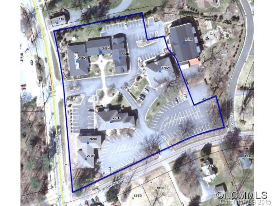 Singleton Centre is a 6-building mixed-use commercial office/retail/cinema/salon/dining  centre 3.5  miles south of Hendersonville in the heart of Flat Rock. A mix of professional & retail tenants in the 19+ rental units. Estimate of 24,900+/- sq. ft., subject to verification. Many long term tenants, most with leases of varying lengths. Next to Flat Rock Village office, across from post office, very near Flat Rock Playhouse and Carl Sandburg.