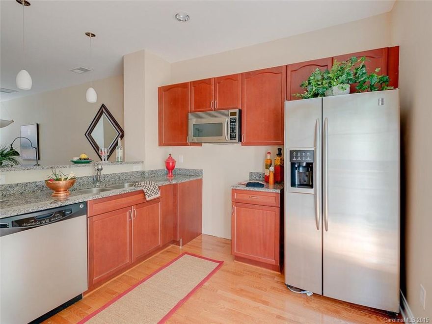 Like new townhome-open floor plan-fully appliance kitchen w/granite & hardwoods-deck is private off kitchen-2 BRs & 2 BTs up-flex space offered on lower level w/half bath. New carpet, paint, hardwoods throughout. Stackable W/D included. Seller paying $2,000 toward closing costs. Walk to downtown Matthews.