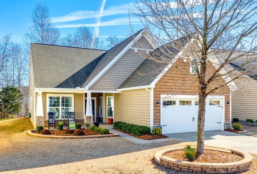 Welcome home! This 1.5-story Albany floor plan seamlessly combines single-level convenience with two-story versatility! The bright kitchen features a large island, stainless steel appliances, granite countertops, & ample cabinets for storage.  The living room, equipped with a gas fireplace & wired for surround sound, offers an inviting retreat for relaxation & entertainment. The primary bedroom impresses with a tray ceiling, huge walk-in closet, & an en suite bathroom with a step-in shower and frameless glass doors. A dedicated office with custom built-ins, a second bedroom, full guest bath, & laundry room complete the first level. Upstairs hosts a third bedroom, another full bath, & a versatile loft space. Enjoy coffee & tea on the rocking chair front porch or head out back to the screened porch with tree-lined views. The garage, complete with an epoxy floor & abundant shelving, ensures organized storage. HOA includes trash/recycling, lawn maintenance, & neighborhood amenities.