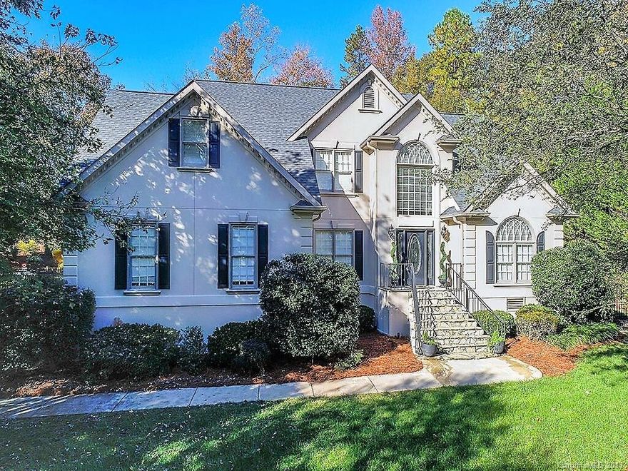 Stunning Home on large lot in lake community! MB on main w/2 walk in closets & built ins; sauna; gorgeous shower; jetted tub; trey ceiling. Gourmet kitchen w/gas cook top; SS appliances; wall oven; granite. Open-concept kitchen-living room with beautiful stone fireplace. Upstairs has 3 large bedrooms & 2 Baths including the ultimate cinema room that includes remote LED lights in crown molding. Separate staircase to lower level. Private fenced yard w/screened porch; stamped concrete patio & pool.