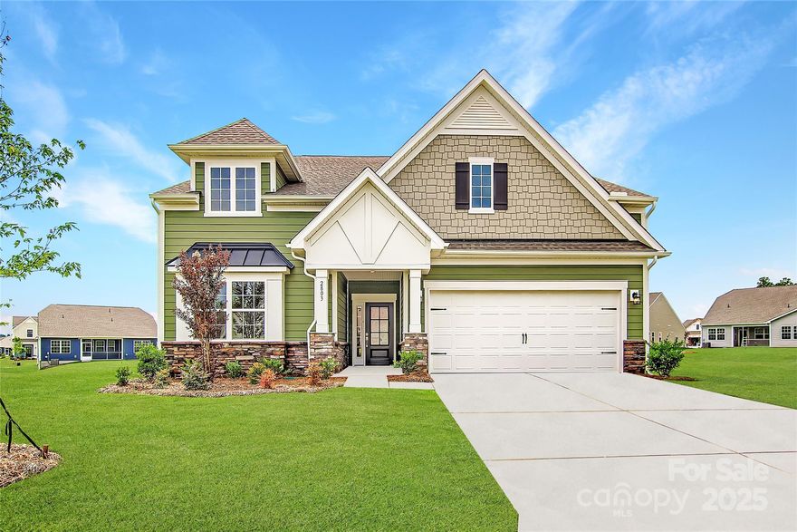 This new two-story Dorchester floorplan combines elegance and comfort. At its heart is a first-floor Great Room flowing into a chef’s kitchen and a breakfast nook with a door to the covered patio. A formal dining room is ideal for memorable meals. Three bedrooms including the owner’s suite are situated on this floor. Upstairs are a bonus room and a fourth bedroom, and adding a study is an option. Plus, our signature Everything's Included program means you will get quartz or granite kitchen countertops, subway tile backsplash, ceramic tile, and luxury vinyl plank flooring at no extra cost! Welcome to Elizabeth, a sought-after master-planned community located in the heart of Fort Mill, offering 7 collections of new homes. Future amenities include a swimming pool, clubhouse, fitness center, sport courts, playground, walking trails and more. This community offers close proximity to highly rated schools, dining and recreation, plus it's conveniently located just 19 miles from uptown Charlotte.