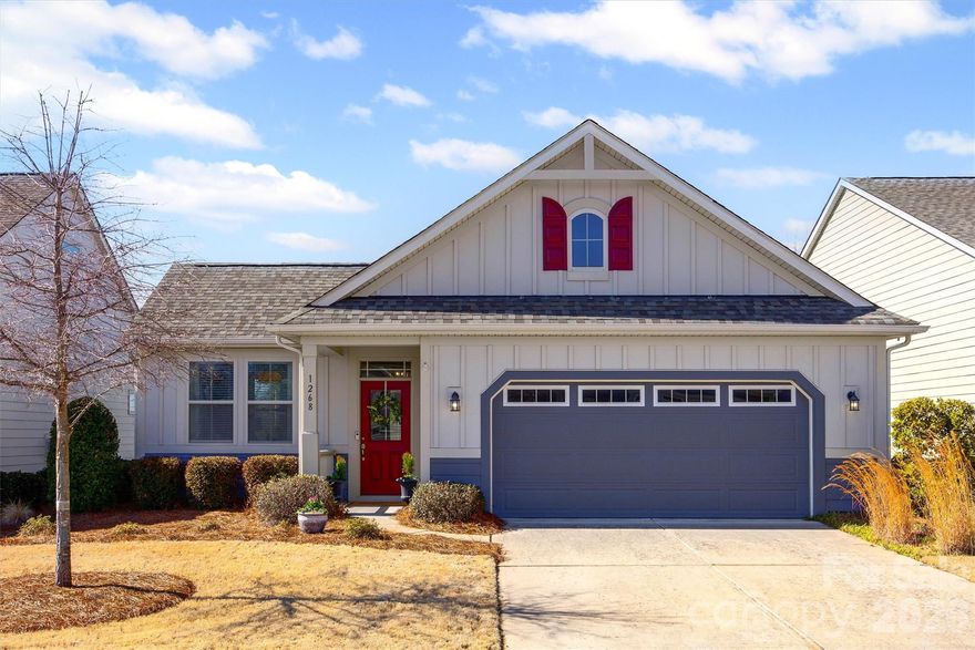 Welcome to this beautifully designed ranch home nestled in highly sought after Tega Cay! This cozy yet spacious home offers comfortable modern living with functional features and updated light fixtures throughout. Step inside to find beautiful engineered wood floors throughout the main living areas, complemented by neutral paint and an abundance of natural light. The open concept layout includes a flex room- perfect for an office, living room or guest space. The stunning kitchen boasts a sleek gas stove accented with a beautiful trimmed range hood, oversized island, spacious walk in pantry & separate dining area. The great room features a cozy gas fireplace perfect for relaxing evenings at home. The serene primary suite offers a spacious bedroom with accented tray ceiling. Primary bath boasts neutral tile shower & tile flooring, tasteful cabinetry, double vanity and separate water closet. The large walk in closet conveniently connects to the laundry room. Secondary bedroom ensuite offers a private retreat with walk in closet and connecting bath. A drop zone is located just off the garage entrance. Enjoy outdoor living on the expansive side patio, perfect for morning coffee or entertaining. The vibrant community offers a clubhouse, outdoor pool, pocket park, sidewalks, and scenic walking trail just steps from your front door. Lawn maintenance included with HOA. Convenient to shopping, restaurants, entertainment, medical. Minutes away from beautiful Lake Wylie!