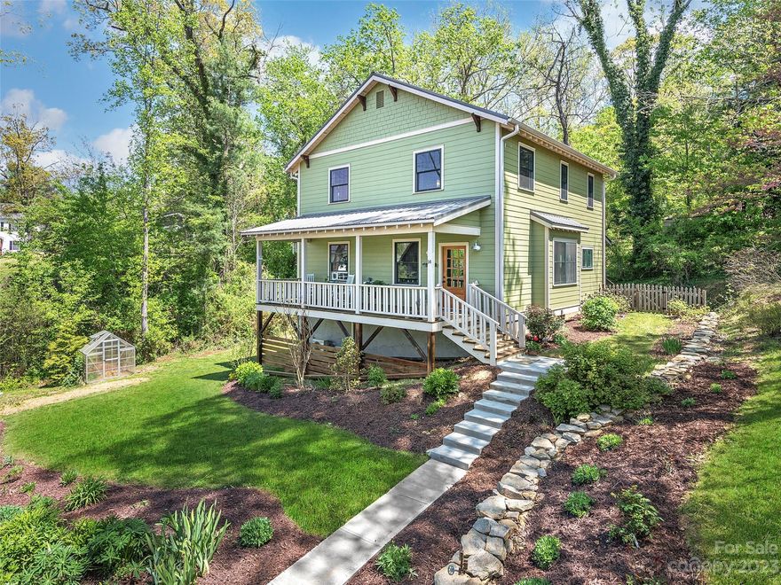 Located near N. Main Street in Historic Downtown Weaverville, discover two quality-built homes nestled on over half an acre with gorgeous, mature perennial gardens. The main home is spacious and light-filled with custom design touches, beautiful wood doors, and hardwood floors throughout. Smart floor plan with 4BR/3.5 baths on two levels, plus a newly remodeled and permitted walk-out basement suite with kitchenette, full bath, and large flex area --perfect for home office, media center, guests, or au pair. The large, stunning kitchen and open living spaces indoors and out are perfect for entertaining. Enjoy relaxing on either one of your covered, private porches. So many great spaces in this 2018 build. The charming guest cottage/artist studio has been a successful income-producing short-term rental. The detached cottage also has a large separate workshop/storage area. Close to all conveniences, including shopping, dining, coffee shops, and more.