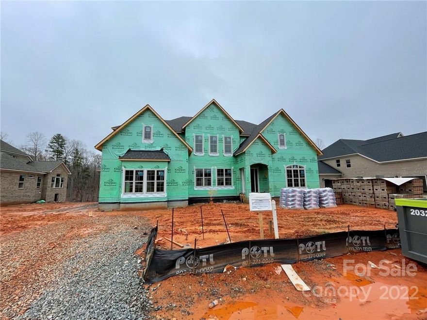 Located on .542 acre lot, home backs up to mature trees. Exterior is four-sides brick w/ stone accents, w/ large rear raised covered patio & outdoor fireplace. Large guest ste off foyer. KIT has white stacked perimeter cabs w/ light stained cabinets at island, contemporary curved extraction hood, GE Monogram SS app w/ 48" dual fuel gas range w/ double ovens, microwave drawer, & 48" built-in fridge, under-cab lights, quartz counters, soft close doors/drawers, & double trash pullout. Morning rm w/ white cabs, wine fridge & 2-sided fireplace shared w/ Family Rm, which features custom built-ins. 16' sliding doors lead to rear porch. Mudroom includes built-ins; Hobby room can be home office. Upstairs Premier Suite has a spa bath w/ freestanding tub, quartz counter, light stained cabs, large tiled shower, extended walk-in closet. Secondary baths all have quartz counters & tiled floors. Large Bonus w/ closet. Light stained oak flooring in many rooms. Stairs have oak treads and iron spindles