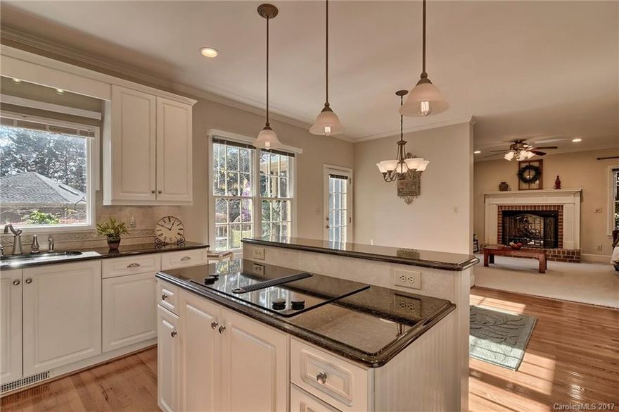 Oh my! How you'll love this beautifully crafted, full brick home on approx. 1/3 acre.  It's nestled on a quiet cul-de-sac street. Inside, you'll find everything you need: Spacious kitchen with custom-made breakfast bar, double ovens, and TONS of natural light. Formal Dining, Living, and Family Rooms mean all the right places to stretch out comfortably. Upstairs, you'll love the master bath, office/nursery, and bonus room. Plenty of side yard, huge deck and enclosed porch, and a nearby creek.