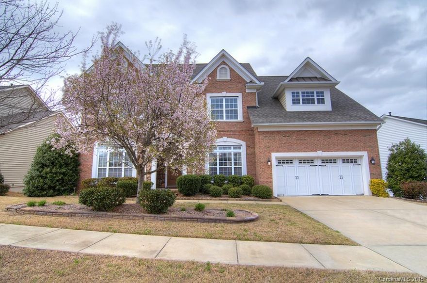 Spacious, elegant, loaded with beautiful features and upgrades.  Backing to woods this home offers a nicely landscaped play yard with a patio and fire pit, delightful chef's kitchen, pretty cherry hardwood flooring, accented by a stone fireplace, guest suite & full bath on main.  Gorgeous Master Suite on second level, along w three bedrooms and huge bonus room.  Basement offers a large recreation room, media room, exercise & an additional bedroom/full bath with tons of storage. Fort Mill Schools