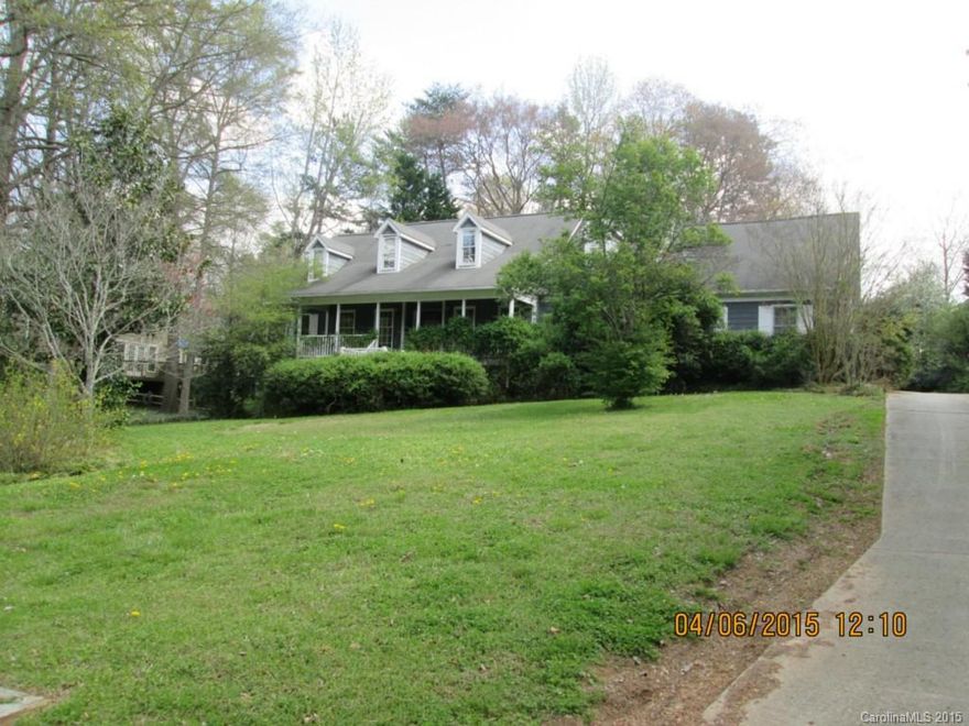 Farmwood home with lots of potential-    Large lot - Rocking chair front porch -  walk in crawl space.  Deck and sunroom overlooking rear yard.   Backload 2 car garage.    Main level features formal living and dining room -  Large family room, breakfast nook with bay window off of roomy kitchen.  Master bedroom on main level.  Upper level has 2 bedrooms and bonus room.    As is with great potential