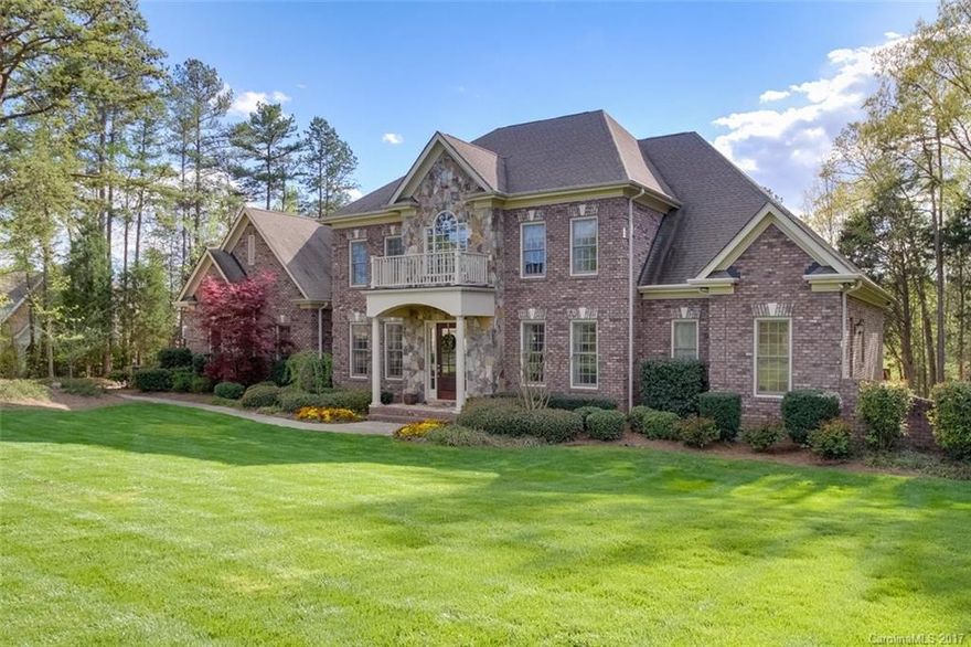 Exclusive Pine Creek, gated community off NC 73, Concord/Kannapolis in Concord School Dist., 5 mins from Afton Ridge, Target, Cannon School & Race Shops. Custom built home on very private, 1 acre wooded lot. Upper & Main floor MBR's, theater room, screened porch, upper sun terrace. All 5 bedrooms have full, private baths.  Resort backyard features heated swimming pool, hot tub, fireplace, pool house, full outdoor kitchen, 1/2 bath, storage area, custom treehouse, & for golfers, a driving range!