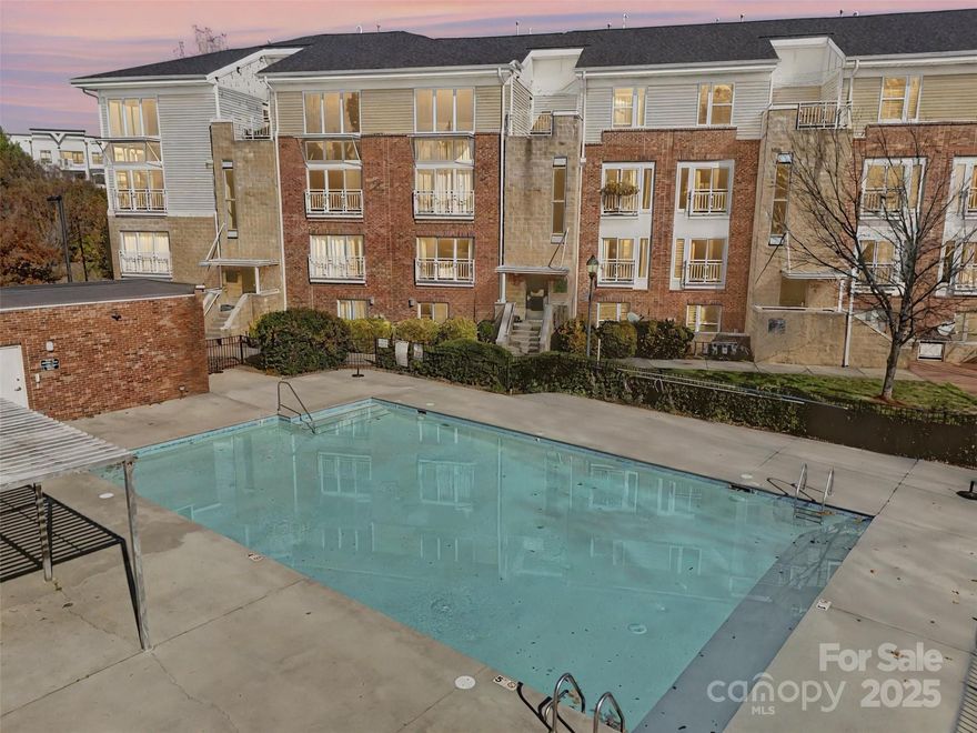 You’ll LOVE this stylish two-level condo in Noda, complete with a coveted attached garage for ultimate convenience. No communal hallways here: simply walk right in and enjoy the comfort of home. The main level features an open, light-filled layout with sliding doors overlooking the community pool. The spacious living area flows seamlessly into the dining space and kitchen, which offers updated appliances, a pantry, and a full laundry room. A guest powder room is tucked nearby, along with the roomy primary suite featuring a walk-in closet and an en-suite bath with dual vanity. Downstairs, you’ll find a second generously sized bedroom with its own en-suite bath and sliding doors that open to a terrace. The lower foyer connects directly to the 244 sq ft attached garage — a unique layout in this community. All this is just a short stroll to NoDa’s vibrant dining, shopping, arts scene, the light rail and a new Sprouts grocery store. Easy living meets unbeatable location. Welcome home!