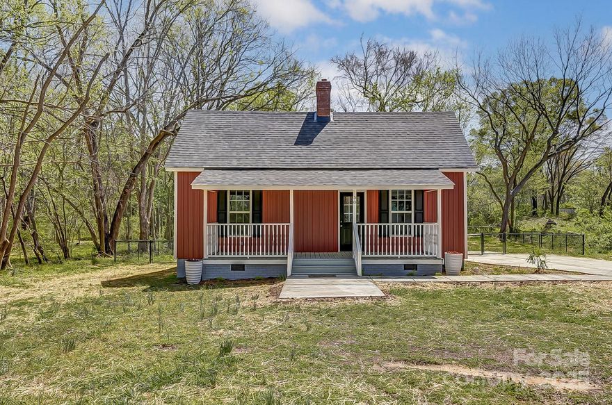 Step into timeless charm with this one-of-a-kind bungalow featuring two oversized bedrooms, extra closet space, and original heart pine floors that tell a story. Cozy up by the living room's wood-burning fireplace or gather in the spacious eat-in kitchen, complete with custom cabinetry, tile floors, and brand new appliances. The laundry room is conveniently located just inside the back door. Enjoy morning coffee or evening sunsets on the classic country front porch, ideal for rocking chairs and quiet moments. Out back, a large deck flows seamlessly to a second-tiered deck overlooking the wooded backyard - fenced and full of potential. No HOA, and almost everything is new inside and out. Reach out now to schedule your tour.