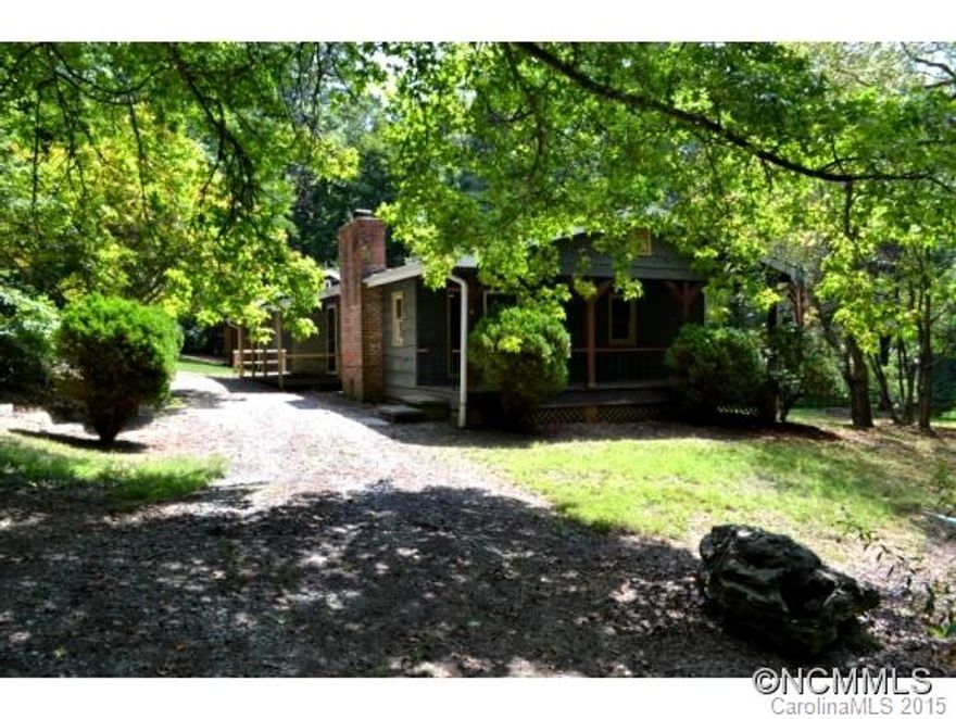 Creative style! Hand-crafted home with wormy chestnut salvaged from Biltmore Estate in main and guest house(not counted in SF, but measures 338 sf, BR, bath). Shop, garage, carport, tall walk-in rain shower, under counter mounted sink, granite counters, HW floors, double paned windows, beamed cilings, 2 skylights, stone FP with woodstove in each.  Close to shopping and schools, but private country feel.