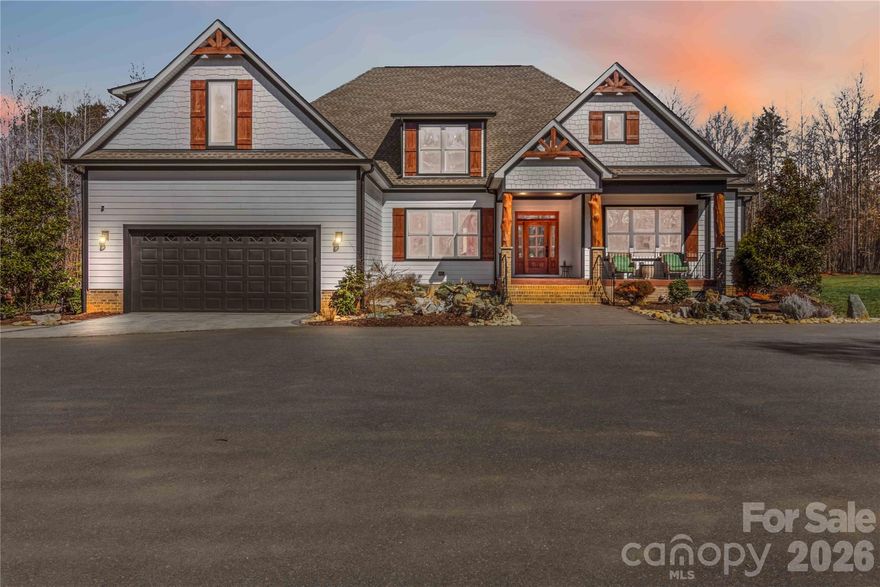 Tucked away on nearly 12 private acres, this exceptional luxury estate offers the perfect balance of seclusion and convenience—just 10 minutes to Rock Hill and 15 minutes to Lake Wylie. A stunning koi pond and dual waterfalls welcome you at the front of the home, setting the tone for the thoughtfully designed custom walkways that lead through the property. And don't miss the custom-made porch posts claimed from trees on the property!

The main residence features 5 bedrooms and 5 full baths, with all bedrooms conveniently located on the first floor in a split plan design. The spacious primary bedroom leads to a large ensuite bathroom with soaking tub and oversized tile shower. A second owner bedroom across the home also has an ensuite bathroom.  

Off the foyer, the dedicated office with custom-made sliding doors provides an ideal work-from-home space. An open concept allows for ease of gathering together on the first floor.  The Sonos® surround sound allows you to experience a cinema-like movie in the family room and listen to your choice of music in any of the included rooms. Upstairs, enjoy a second living space with a built-in bar, a full bath, and an exercise or flex room—perfect for entertaining or extended living. The attic provides plenty of room for storage. Additional highlights include two tankless water heaters and an additional three electric backups. 

Outdoor living shines with a covered back porch opening to an expansive patio, complete with a saltwater in-ground pool and waterfall feature, plus a covered pergola ideal for seating and bonfires. There is partial fencing which currently houses the goats, but would be ready for your chickens, sheep or pigs!  The 11.8 acres allows for a multitude of activities not limited to boarding horses, hunting and riding off road vehicles.

That's not all...the property also includes a large multi-use 40' x 40' building with a heated office and bathroom, currently used for a business.  There is additional parking around this building and a dedicated RV parking area with full hookups.  A truly rare and versatile property offering luxury, privacy, and endless possibilities.