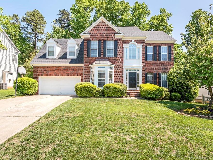 BRAND NEW ROOF  & HVAC System April 2017. Beautiful brick home w/ two-story foyer & two-car garage. Wood floors on main level.  Family room w fireplace & large windows for lots of natural sunlight.  Kitchen has granite countertops & breakfast bar, recessed lighting, SS apps & backsplash & is open to family room & breakfast area.  Breakfast area has large windows and door leading to spacious deck & wooded fenced backyard.   Master bedroom w tray ceilings , en suite bath, separate shower!