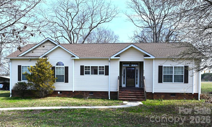 This charming 3-bedroom, 2-bathroom home offers 1,640 square feet of thoughtfully designed living space, blending easy maintenance with a warm, inviting atmosphere. Tucked away on a quiet level lot just off Springs Road, you’ll enjoy a peaceful retreat that is perfectly positioned for a stress-free lifestyle. The location offers short drive times to the area's top destinations. You are just minutes from Downtown Conover and from the heart of Downtown Hickory, making it easy to enjoy local restaurants, shops, and seasonal events like the Hickory 5K Series. Major regional employers and essential services are also within reach, including Catawba Valley Medical Center and Frye Regional Medical Center. Inside, the heart of the home is a cozy living room with a fireplace. The kitchen features ample cabinet space and a central island that’s sure to be the hub for morning coffee preparing meals for family and friends. The primary bedroom suite features a walk-in closet and a primary bath with a double-sink vanity, a separate shower and a garden tub made for relaxing. With two additional bedrooms and a second full bath, there is plenty of room for everyone to feel right at home. Outside, the back deck provides a great place for summer BBQs and the spacious, level yard provides an ideal location any number of outdoor activities.