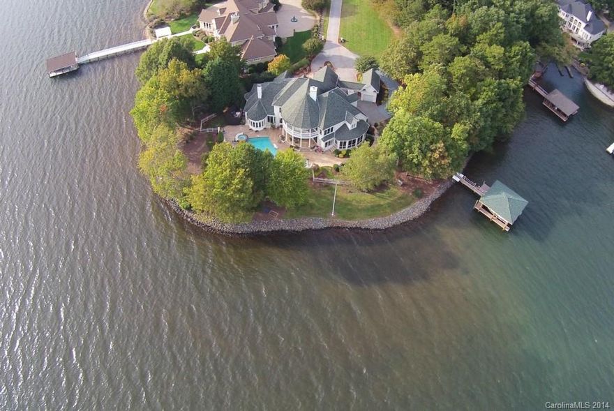 Luxury Living at its Finest on One of the Premiere Points in The Peninsula! Exceptional Quality, Amazing 300+ Ft Shoreline & Elite Privacy separate this Home from Others! Simonini “Street of Dreams” Home boasts: Open Floor Plan, Unparalleled Panoramic Views, NEW Showcase Kitchen w/Grand Island & Top of Line Appliances, Refinished Hardwoods, State of the Art Home Theater, Smart Home Technology, Remodeled BR’s & Baths, Dazzling Pool & Spa, NEW Covered Boat Dock w/2 boat lifts…WOW!