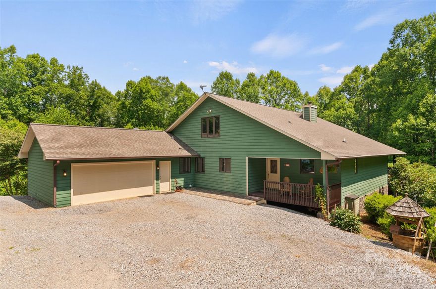 Experience MTN living at its finest in this remarkable 3BR/2BA home nestled on 6.39 acres of serene privacy.Step onto the inviting rocking chair covered front porch & enter into the heart of the home,a cathedral ceiling great room featuring a stunning stone fireplace & floor-to-ceiling windows that frame breathtaking views.Inside,hdwd floors lead into the gourmet kitchen,equipped w/granite countertops,a cozy dining area,& a convenient bar area complete w/a refrigerator & ice maker.The laundry adds practicality,while a spacious loft offers versatile potential.The floor plan enhances privacy w/a primary suite featuring a double vanity BA,alongside two spacious guest BR's & a full hall BA,all conveniently located on the main level.Entertain on the expansive covered back porch & deck,perfect for gatherings w/friends & family.Additional highlights include ample parking,a pull through driveway,an oversized two-car garage,& a new roof installed in 2022.