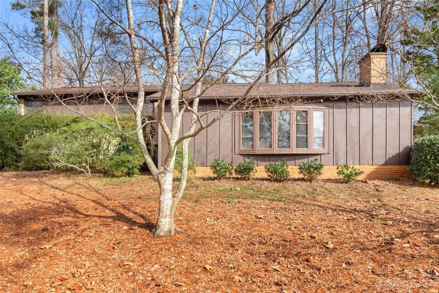 With so many upgrades and quality, unique features, do not miss out on this move-in ready, freshly painted home, located on a beautiful treed lot in Rock Hill. The main entrance leads you to an inviting and spacious great room with vaulted ceiling, beams and a cozy fireplace. Upstairs, on the main floor, you will be greeted by an open and flowing kitchen (with laundry area), dining and sitting area with closets galore, and stunning hardwood floors. The primary bedroom has a seating area that could also be used as a home office, plus a large closet. In addition to the main bathroom, there are 2 further bedrooms, one with a private bathroom. From the kitchen there is access to the back deck, ready for gatherings with family or friends. Enjoy the peaceful back yard, perfect for entertaining and relaxing, plus a workshop and a large storage shed. This well cared for and updated home, with smooth ceilings, a new roof (2023) and HVAC (2022) is just waiting for you to move in and enjoy.