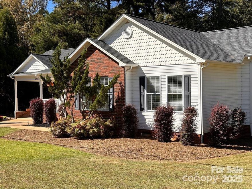 Outstanding location for this charming ranch home! 3-bdrm, 2-bath split floor plan home featuring an eat-in kitchen and a separate dining room. The screened porch has been transformed into a warm, cozy den with an electric fireplace and bar area, perfect for relaxation and entertaining. Just a 1 minute drive or a short walk to the Rock Hill Galleria Shopping Mall and Sam's Club, Target, Dunkin Donuts, Best Buy and more, with easy access to I-77! Nestled on a stunning .60 acre lot with County Taxes, you'll enjoy the peaceful feel of the countryside while being close to everything! The home boasts numerous updates, including a new 12x24 deck, 15x38 RV pad with water and 50 amp service and 220V electricity, plus a new roof with upgraded shingles in 2022, HVAC system 2023, new wood laminate floors & carpet 9/24,  fresh paint, new kitchen cabinet doors 10/24, and a new well system 6/24!  Move in ready and rare find in coveted Sturgis Estates! The agent is a friend of the sellers.