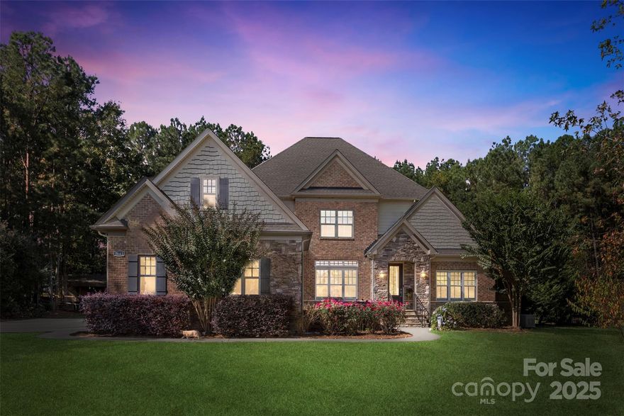 Welcome to Olde York Farms — a rare opportunity to own a true country estate in one of York’s most exclusive communities. This exceptional property showcases luxury country living at its finest on 5.66 acres of mature, wooded landscape. Fully fenced with a private gated entrance, the home offers an elegant estate presence with unmatched privacy and tranquility.

Enjoy outdoor living at its best with a custom stone fireplace and pizza oven, expansive patio, and beautiful sports pool — all surrounded by the beauty of nature. Inside, you’ll find a formal office with double glass doors, a formal dining room, and a soaring two-story great room that opens to a spacious kitchen featuring picturesque views of the property and outdoor amenities.

The primary suite on the main level boasts a luxurious spa-like bath and generous walk-in closets. An additional guest bedroom on the main level adds flexibility and convenience. Upstairs, you’ll find three more bedrooms plus a large bonus room over the garage — perfect for recreation, media, or hobbies.

With thoughtful design, abundant storage throughout, and numerous upgrades inside and out, this home offers both comfort and peace of mind. Enjoy low South Carolina taxes, award-winning York schools, and a convenient 30-minute drive to Charlotte, offering the perfect blend of country serenity and city accessibility.