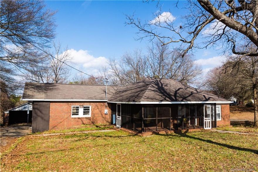 Motivated seller! PRICED BELOW TAX VALUE! Come enjoy country living right outside of the city limit! Almost 10 acre lot - two thirds is wooded! Hike in your own backyard at any time you desire. Large wrap around front porch. Beautiful original hardwood floor adds charm to this full brick range style home. Side load two-car garage makes the home even more desirable. Eligible for USDA loan! Put this on your BEST BUY list! SOLD AS IS!