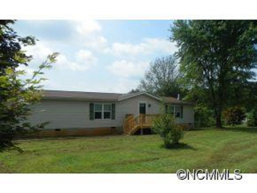 3BR, 2BTH house built in 2006 on approx. 1 acre. Level front yard w/totally fenced in back yard perfect for children or pets. Loads of garden space. Open FP, living room w/lovely rock wood burning fireplace & built in bookshelves. Spacious kitchen w/2 pantries. New pergo in foyer and newer HW heater. New front deck. Master bath w/double sinks, garden tub, separate W/I shower. 2008 10 x 16 storage shed & 2007 Husqvarna Riding Mower!!