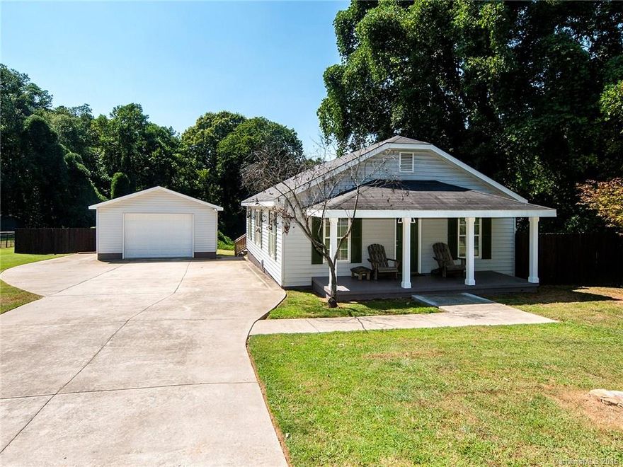 Welcome home to this updated dollhouse in Mooresville. Single floor living with large, rocking chair porch and detached garage. Huge driveway provides for plenty of space to turn around. Lots of space to spread out and an expansive deck for entertaining. A completely updated kitchen and full bath boast the current trends. In-home laundry and additional half bath round out the perks of this home. Mooresville Graded School Distric! This one is a must see!