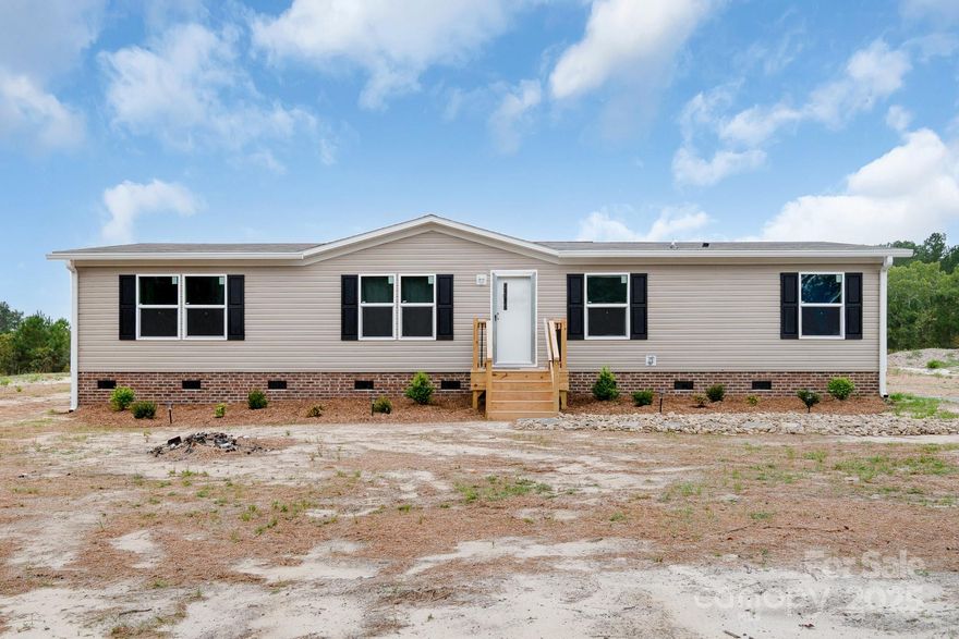 Welcome home to this nearly new 4-bedroom, 2-bath manufactured home in peaceful Bethune, South Carolina — just 4 months young and ready for its next chapter! Situated on over an acre of land, this property offers space, privacy, and all the modern conveniences you’ve been searching for. Step inside to an airy open floorplan that’s perfect for everyday living and entertaining. The split-bedroom layout provides privacy, while the fully equipped kitchen and full laundry room make life easy and efficient. Outside, enjoy your private, gated driveway, brand-new storage shed, and a fully fenced backyard—ideal for pets, play, or peaceful evenings under the stars. This home is detitled, has county water, and is move-in ready.