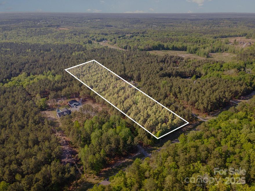Discover the perfect place to build your dream home on this beautiful 4.99-acre wooded lot along Flat Creek Highway in Lancaster, SC. Surrounded by mature trees and peaceful natural surroundings, this property offers privacy, space, and a truly scenic setting. Whether you're planning a custom home, a private retreat, or a future investment, this nearly 5-acre parcel provides the ideal backdrop. With no HOA, you have the freedom to design and build to fit your vision. Conveniently located just minutes from downtown Lancaster and only about an hour from Charlotte, you'll enjoy the best of both quiet country living and easy access to modern amenities!
