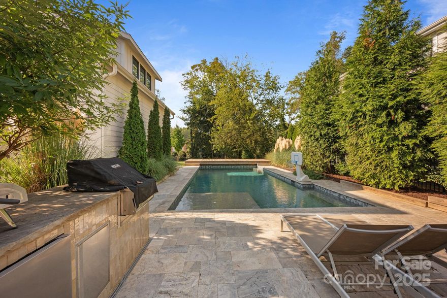 SIGNIFICANT PRICE CHANGE; NEW INTERIOR PAINT, NEW PICTURES. Absolutley beautifully maintained home,walkable to downtown Davidson.This home built in 2017 by 2023 Charlotte Builder of the year is on a .44 acre lot with sprawling fenced in yard with mature landscaping around the salt water pool.Enjoy lounging by the pool or enjoy the spacious back porch with gas fireplace. There is an outdoor grill island with built in wood fire grill & beverage fridge. The house is finely finished with a bright, open floor plan, a large granite island in the kitchen & a living area with gas fireplace, built in shelving & window seat. A puppy space is under the steps.Large primary bedroom upstairs with walkin closet & bath with massive free standing bathtub, dual vanities and 2 headed shower. One en suite BR/bath and 2 bedrooms with Jack & Jill bathroom. Also upstairs is a laundry room w/granite countertops & sink. Above the garage is a 431 sq ft flex spce w/full bath.This space has been used as an art studio. The 2 car garage has a 3 person sauna. No HOA.