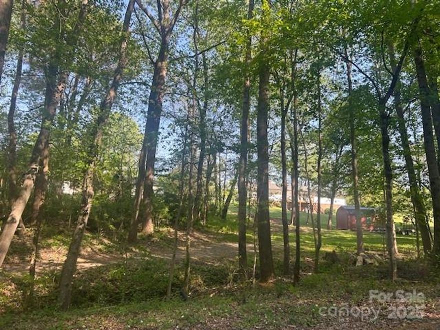 Pretty neighborhood! Discover the perfect place to build your dream home in the beautiful Northmont subdivision. This established neighborhood offers beautiful landscaping among attractive well maintained homes. The lot is partially cleared and  offers privacy and convenience. Minutes from Downtown Statesville and I40. Close to grocery, restaurants and other amenities.  Perfect infill building lot.