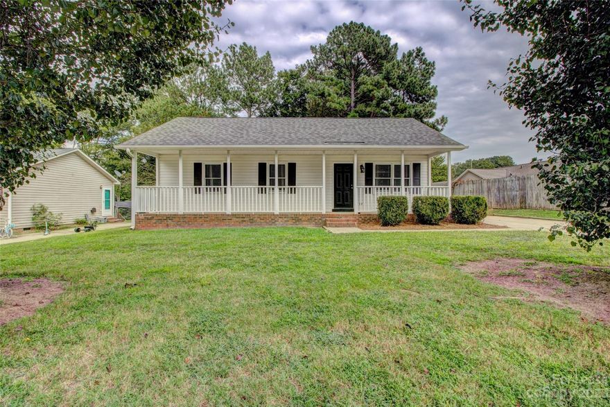Single family with large covered front porch, appliances included, Concrete drive, fenced yard, outbuilding