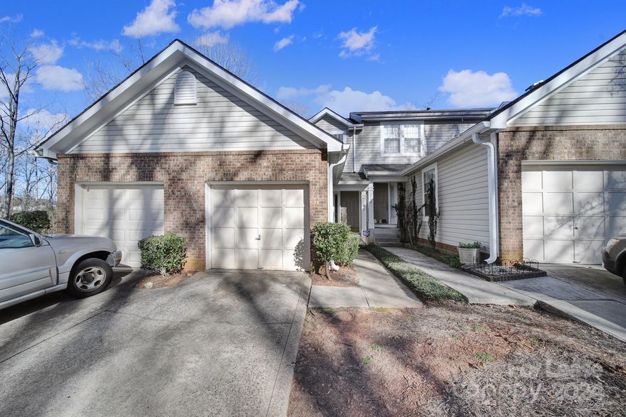 3 bedroom, 2 1/2 bath townhome! Main floor living is open concept kitchen with stainless appliances opening up to dining area/great room wood burning fireplace. Double doors allow for a lot of natural light and open to deck overlooking a private back yard! Upstairs boast 2 large bedrooms and 2nd full bath with dual sink vanity. Walk out basement with private patio has a LARGE 3rd bedroom or bonus area, walk in closet, full bath w/dual sink vanity and laundry room. Laminate floors throughout with exception of bathrooms/entry that offer tile/linoleum. Home sits at end of quiet street with a green space. Community pool, close to shopping & dining!