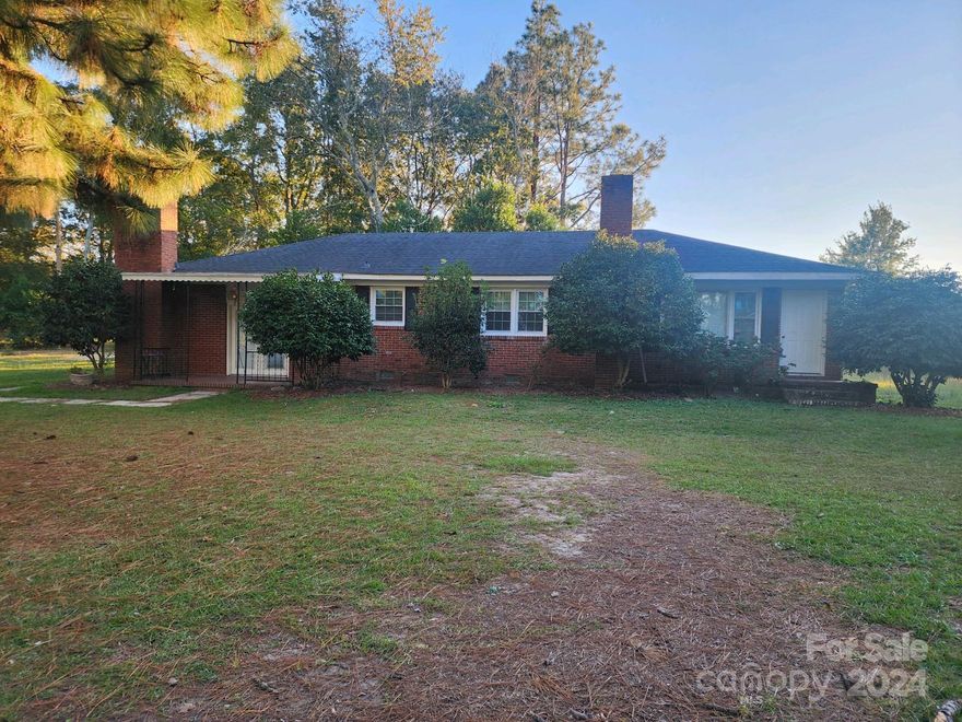Don't miss this brick ranch located on Hwy #151 in McBee, SC, situated on over 1.4 acres. It features a kitchen with granite counters, spacious den with fireplace, dining room, living room, 3 bedrooms and 2.5 baths.  There is plenty of room to roam on this large lot with a detached metal shop building, for your hobbies or storage needs.