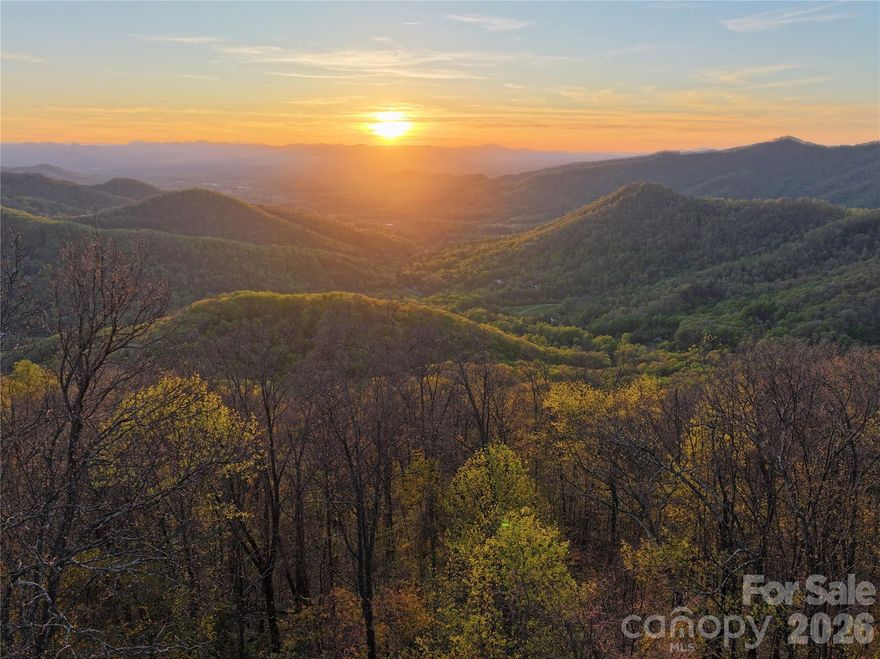 191+/- Acres of Private Mountain Paradise – Just Minutes from Weaverville, it's your own private slice of the Blue Ridge Mountains. This exceptional property features sweeping panoramic views from nearly every vantage point. Bordering conservation land and USFS, this tract features a newly cleared and grated road and gorgeous homesite with incredible views, dramatic rock outcroppings, and rich hardwood forests filled with white tail deer, black bear and turkey. The elevation ranges from 2840ft to 4690ft with stunning topography, well-established trails and roads ideal for hiking, mountain biking, horseback riding, ATV exploration and even an off-grid hunting cabin. Multiple build sites offer breathtaking long-range views just perfect for a dream mountain home or family compound. Just minutes from Bull Gap Overlook, the Blue Ridge Parkway, and the Mountains-to-Sea Trail, this is a true haven for nature lovers and outdoor enthusiasts. Currently enrolled in the forestry program (with significant tax benefits) and approved for conservation, this rare high-elevation tract offers strong value in a highly desirable location. Don’t miss your chance to make it yours today. It's a must see.