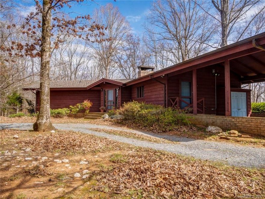 Secluded,  all natural interior, sprawling ranch basement home in a mountain-like setting situated on 49 acres. Front door foyer with a brick / stone floor leading to hardwood floors throughout the home. Huge brick fireplace located in great room gives ambiance to this area & dining room. Large windows overlooking a wrap around deck w/ fantastic views. Master on the main, spacious study w/ built-ins. Hugh basement with its own bedroom and bath featuring the second fireplace. An impressive home.