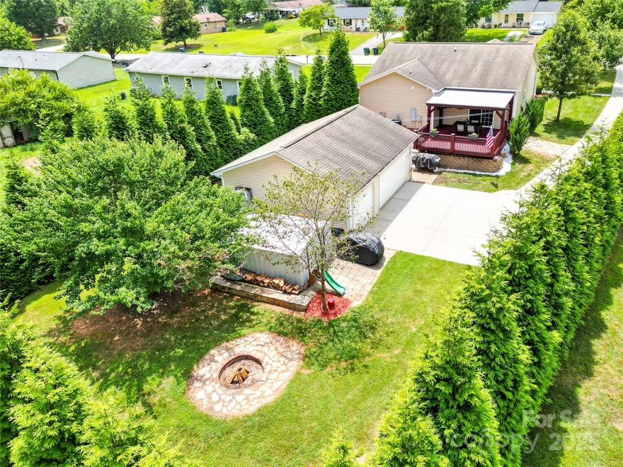 **MULTIPLE OFFERS RECEIVED- Highest & Best by Wednesday July 30th @9pm** GARAGE GOALS, PRIVATE BACKYARD, PRIME LOCATION & SO MUCH MORE!! This rare find offers a detached 3-car garage complete with heating and air and 220-volt outlets, perfect for car enthusiasts or hobbyists. There's also an additional 12x12 shed with an air compressor. This home features 3 bedrooms & 2 full baths, LVP flooring throughout, 9 ft ceilings & plenty of natural light. The private backyard, surrounded by mature trees includes a covered back deck & a cozy fire pit area creating your own backyard bliss. Updates include - HVAC 2021, new kitchen appliances 2024, hot water heater 2025. Just a short walk to DT Troutman. NO HOA! This one of a kind property truly checks every box. Schedule your showing today and see for yourself!