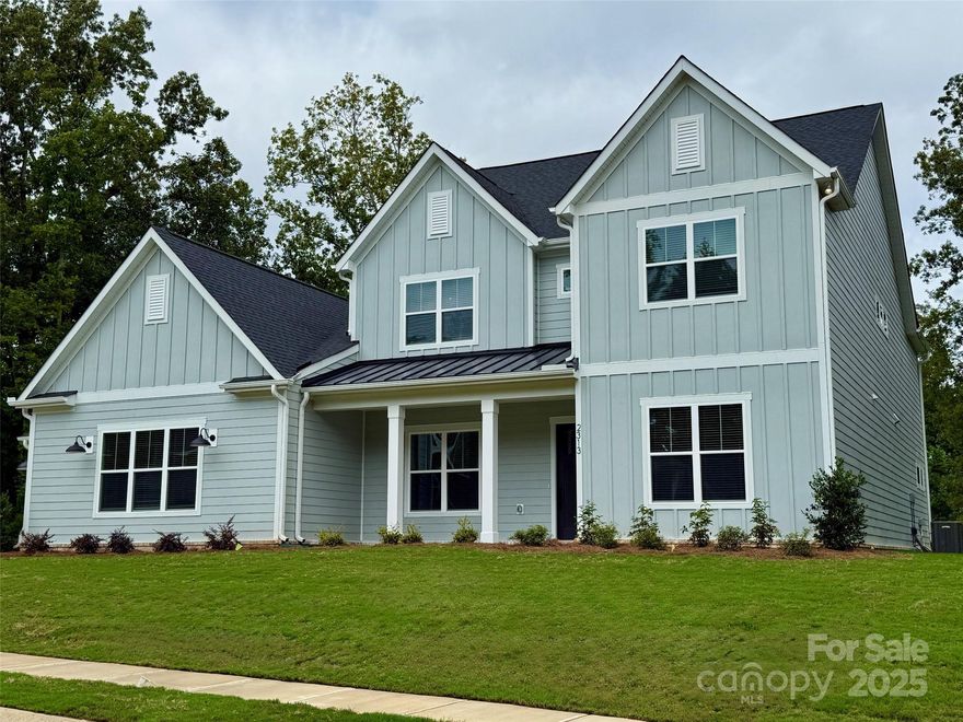 WILL NOT LAST LONG, LAST ESTATE LOT IN BRETAGNE!!! Brand new gorgeous Modern Farmhouse home in Fort Mill on 1.2 acre estate lot! Great location, low taxes, convenience to schools, shopping, and restaurants - close to Ballantyne and just 30 mins to Uptown Charlotte! Hurry, still time to choose design selections!  Offering 4200+SF and unsurpassed amenities! Spacious main level primary suite & luxe bath with designer tile, freestanding tub, large shower, double vanity, water closet & a huge walk-in closet!  Gourmet KT with 48" double oven dual fuel range, quartz counters, oversized island, walk-in pantry; great room with fireplace & sliding glass door leads to covered deck; guest suite on main level too!  Upstairs, find 3 additional bedrooms, 2 baths, plus bonus room & flex/media room. Designer features thru-out along with LVP flooring & 10' ceilings w/8' doors on main level, craftsman style moldings, quartz counters in baths, upgraded lighting, plus much more!  4th car garage option!