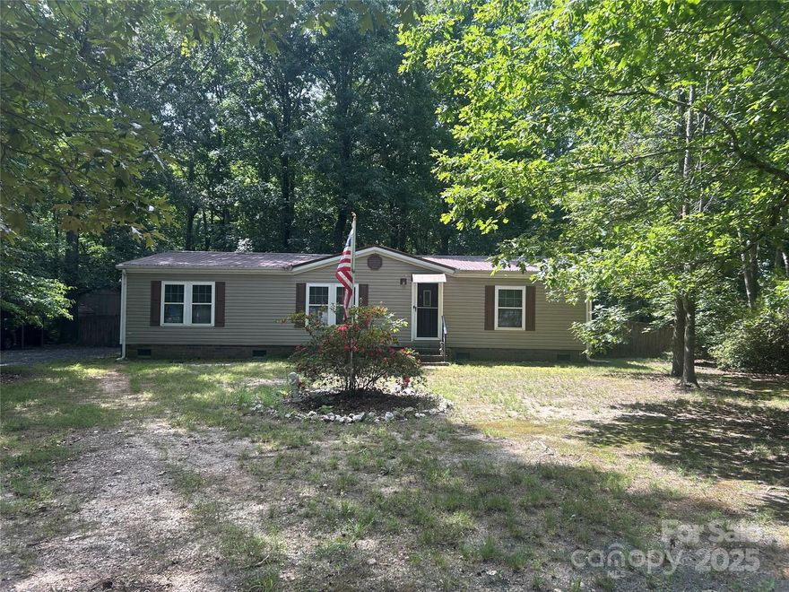 Take a look at this well-maintained 3-bedroom, 2-bath home sitting on just under an acre of land. Recent updates include a newer metal roof, windows, HVAC system, and hot water heater. With a spacious backyard this home is ready for your personal touch.