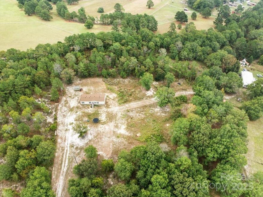 If you are looking for an established rural location, with a spacious home and lots of extras, on 2.03 acres of land, this one may be for you! This beautiful home has 3 BR and 2 BA. The split floor plan offers plenty of privacy to the primary bedroom and en-suite bathroom, that features a large walk-in shower, deep soaking tub, double sinks, vanity and walk in closet. The heart of the home is the spacious kitchen featuring an island, perfect for meal prep and gatherings. A convenient computer niche offers a dedicated workspace and a large utility room adds even more functionality to your everyday living.Two additional bedrooms provide flexibility for guests, a home office, or a growing family. Outside, the lot provides endless possibilities—whether you dream of gardening, setting up a play area, or simply enjoying the serene views of the countryside. Schedule your showing today!