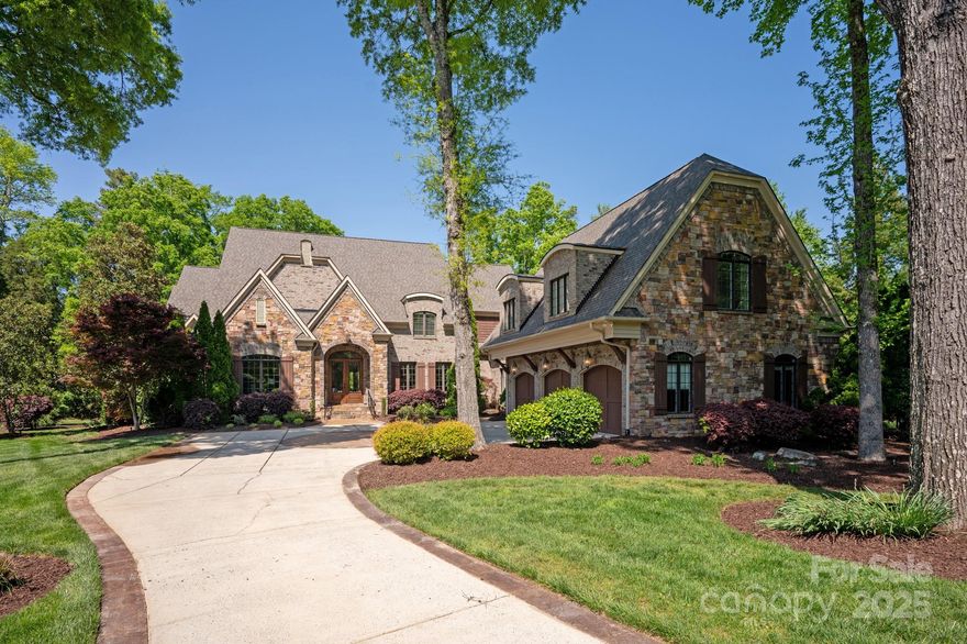 Beautiful french country home on prime cul de sac lot in popular gated Providence Downs community with park like backyard! Great open floor plan includes a large primary suite on main with his and her walk in closets + plus private office. Chef's kitchen features commercial 48" range, built in fridge HUGE walk in pantry & TONS of cabinet space! Kitchen opens to a large Keeping Space featuring a vaulted ceiling, gorgeous stacked stone fireplace and custom built ins. Upstairs includes 4 oversized additional bedrooms each with a walk in closet, 4 full baths, spacious bonus room, second office and large dedicated theater room. Outside enjoy the great North Carolina weather on the lovely screened porch with fireplace. Backyard feels like a park with beautiful walking path and lovely professional landscaping. Other features include brand new 2024 ROOF;4 new a/c units; Aluminum clad windows; HUGE drop zone! Walk in storage! Zoned for Marvin Schools!